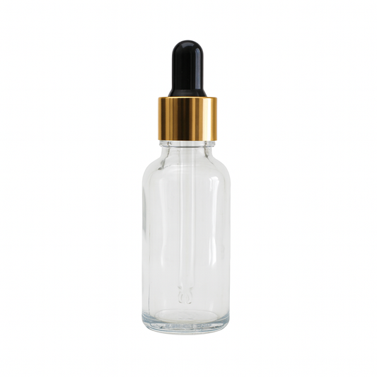 Clear glass dropper bottle with a gold cap 